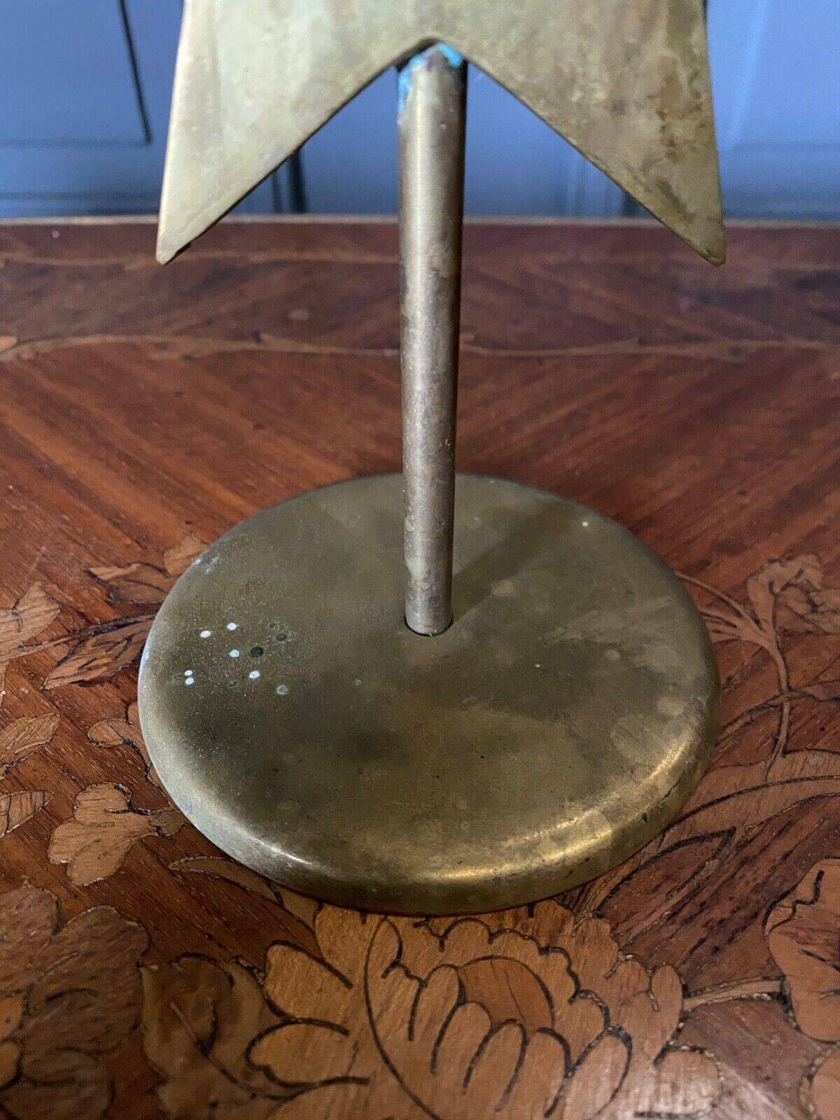 Pair of brass candlesticks decorated with 20th century stars