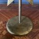 Pair of brass candlesticks decorated with 20th century stars