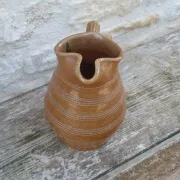 Old stoneware wine jug with patterns