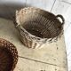 Set of 3 vintage brown wicker baskets from the 1960s, different sizes.