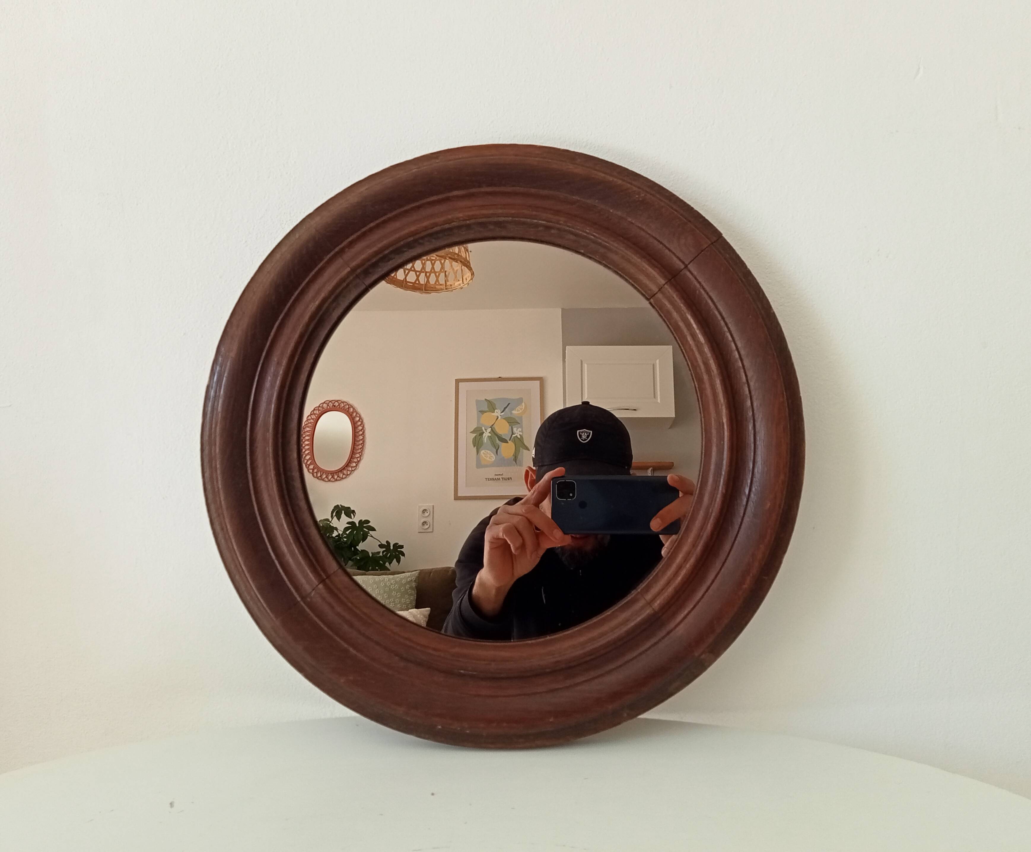 Antique round wooden mirror