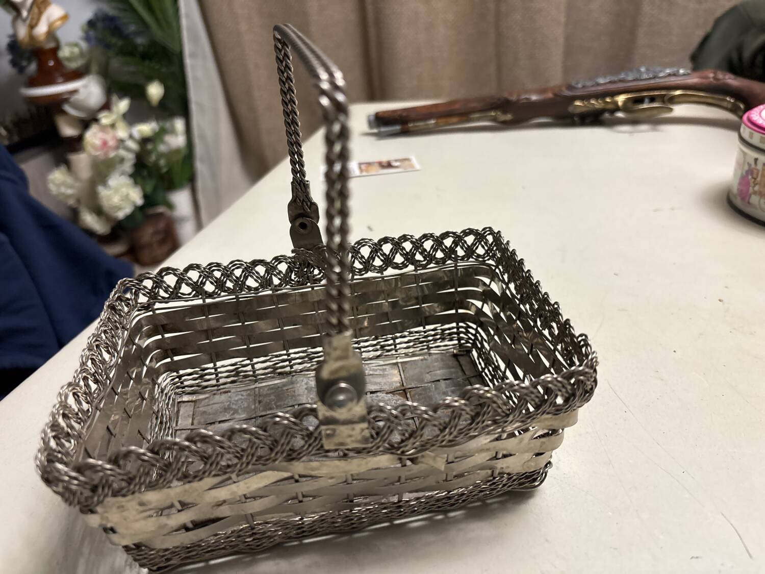 Antique woven metal basket