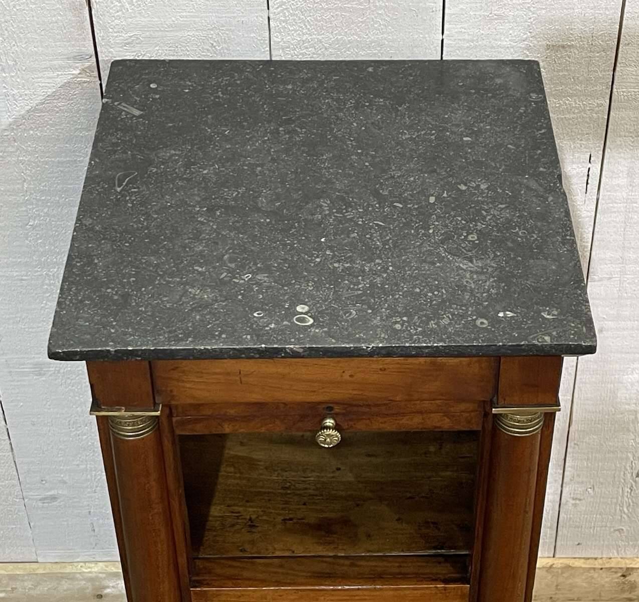 Empire bedside table from the 19th century in cherry wood and black marble.