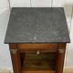 Empire bedside table from the 19th century in cherry wood and black marble.