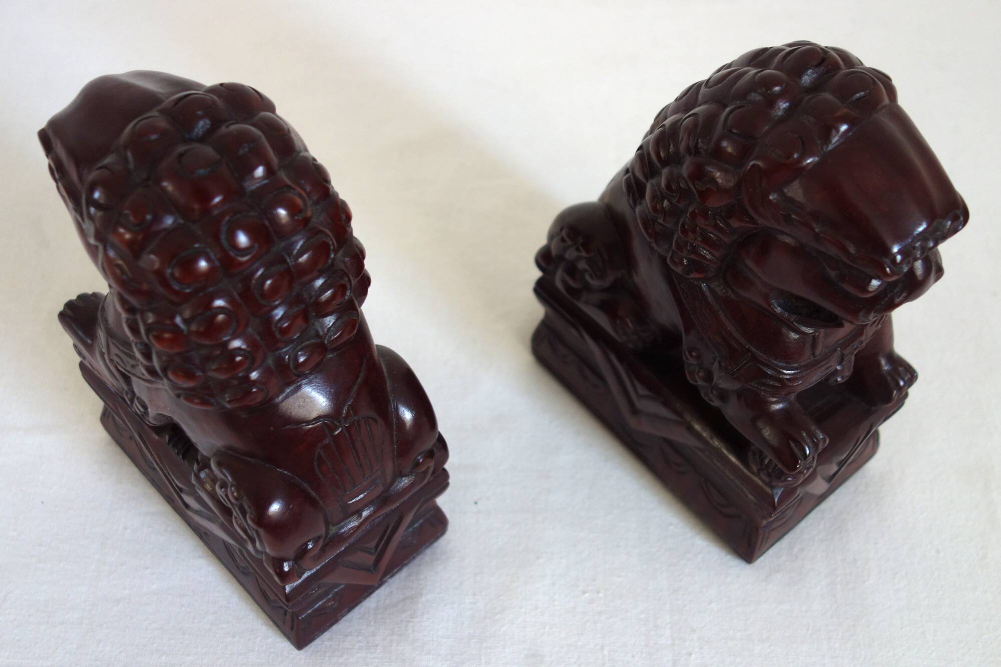 Vintage wooden pair of Foo dogs.