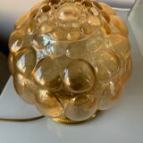 Old vintage table lamp made of amber molded glass