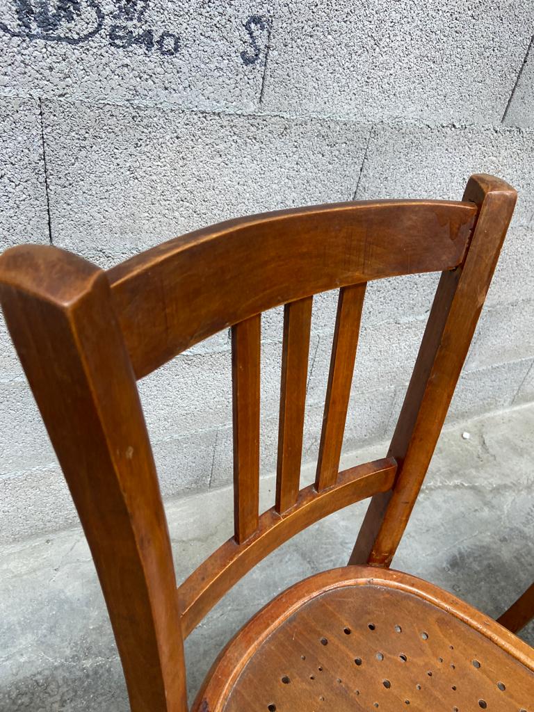 Two vintage curved wooden bistro chairs