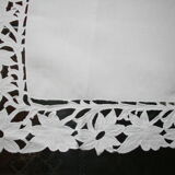 Old square tablecloth decorated with lace