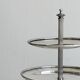 Vintage three-tiered serving stand in patinated silver metal.