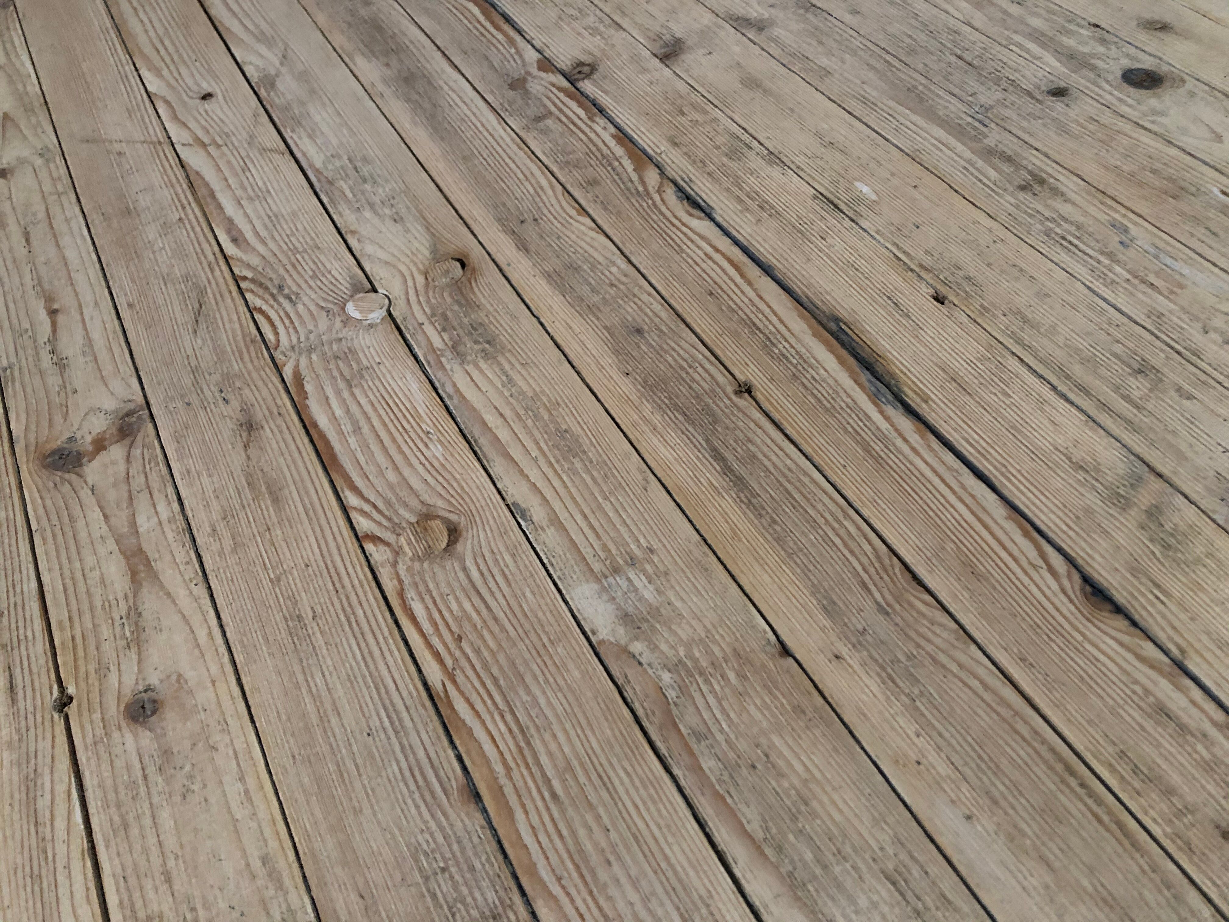 Washed-out wooden dining table