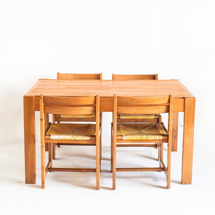 Extendable table and 4 chairs set with a rationalist design in solid elm wood. France, 70's