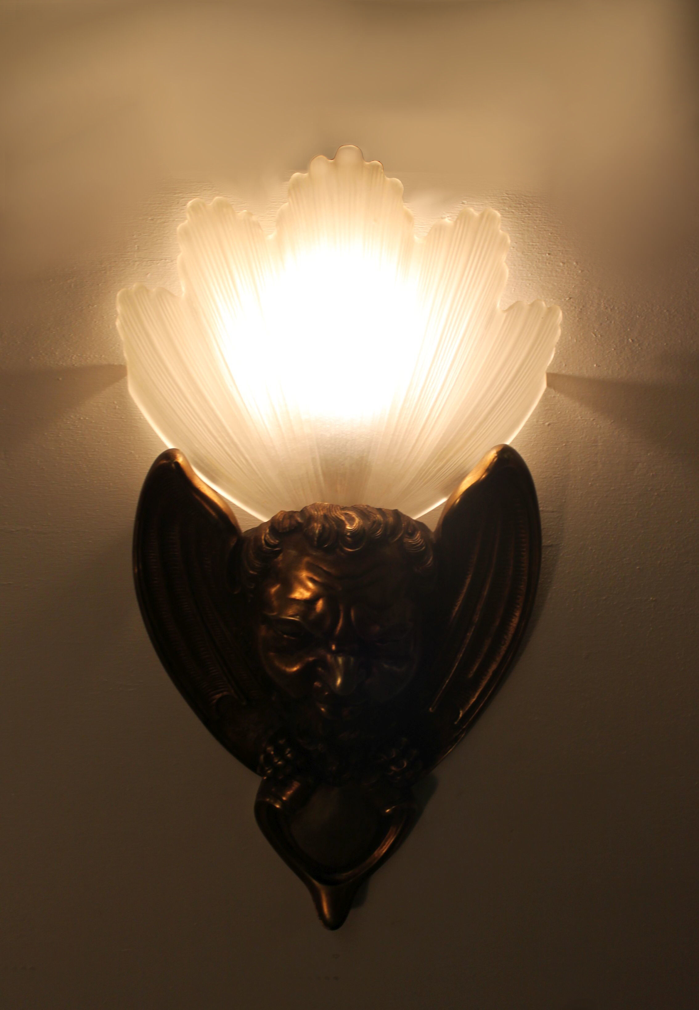 Pair of bronze wall lamps Art Deco style early twentieth century