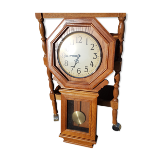 Old wall clock with solid wooden pendulum