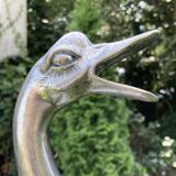 Old vintage lamp representing a duck in silver metal with wooden base