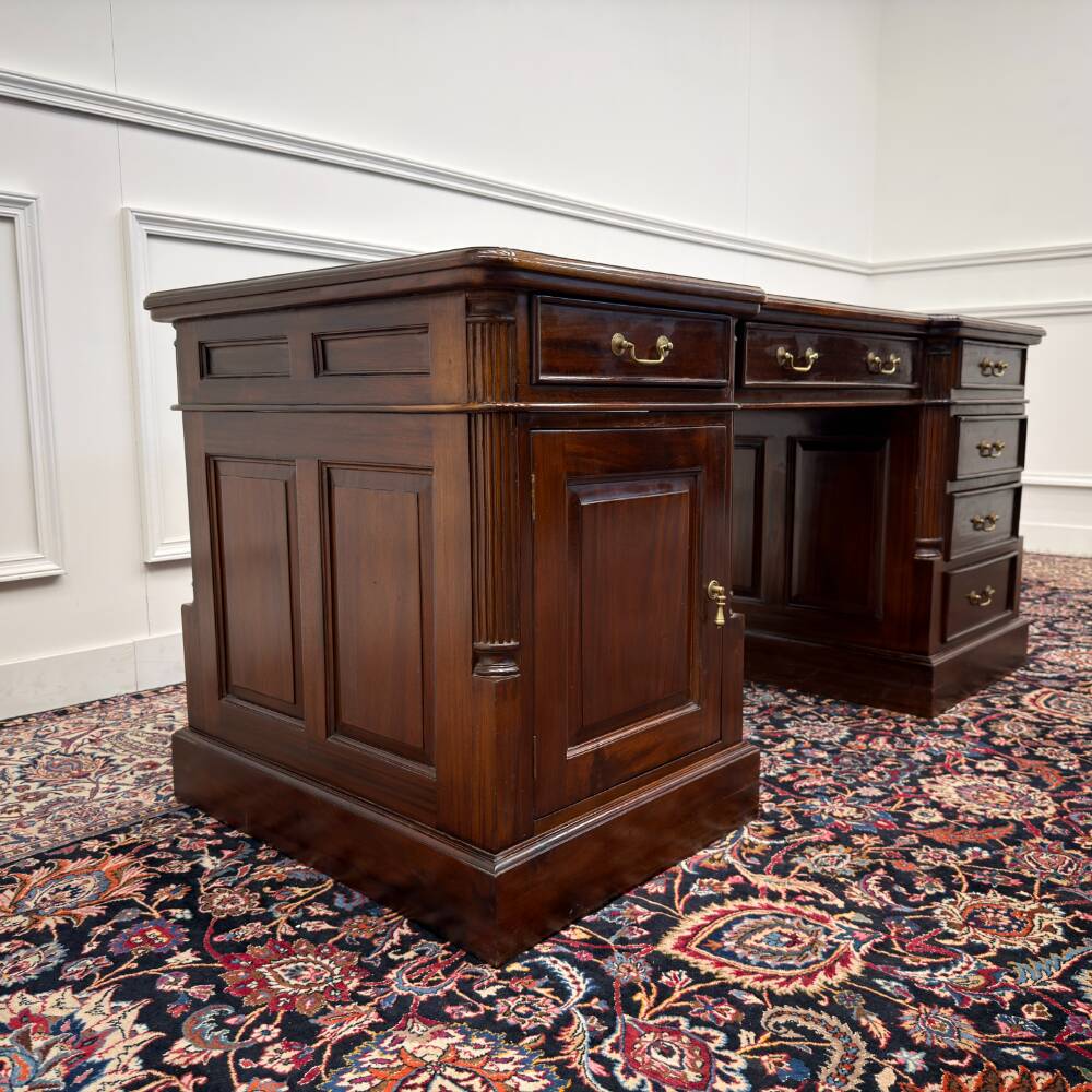 Classic English desk with green leather inlay.