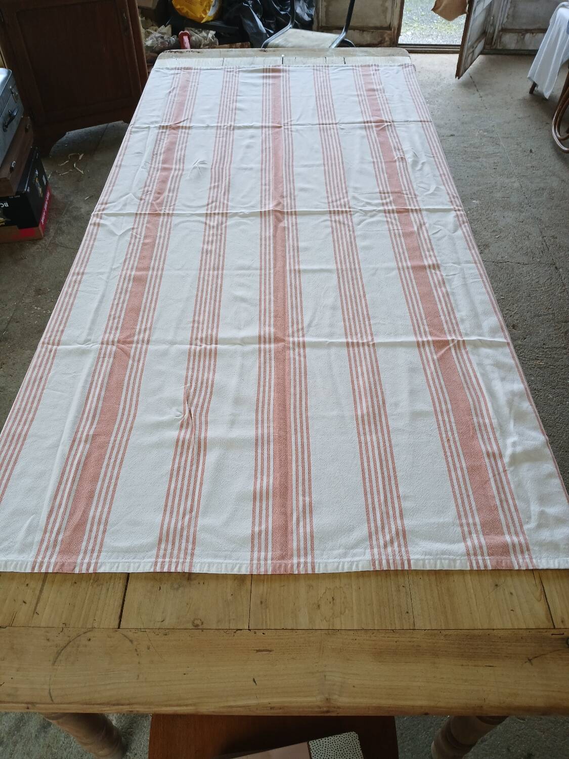 Old pink and white tablecloth