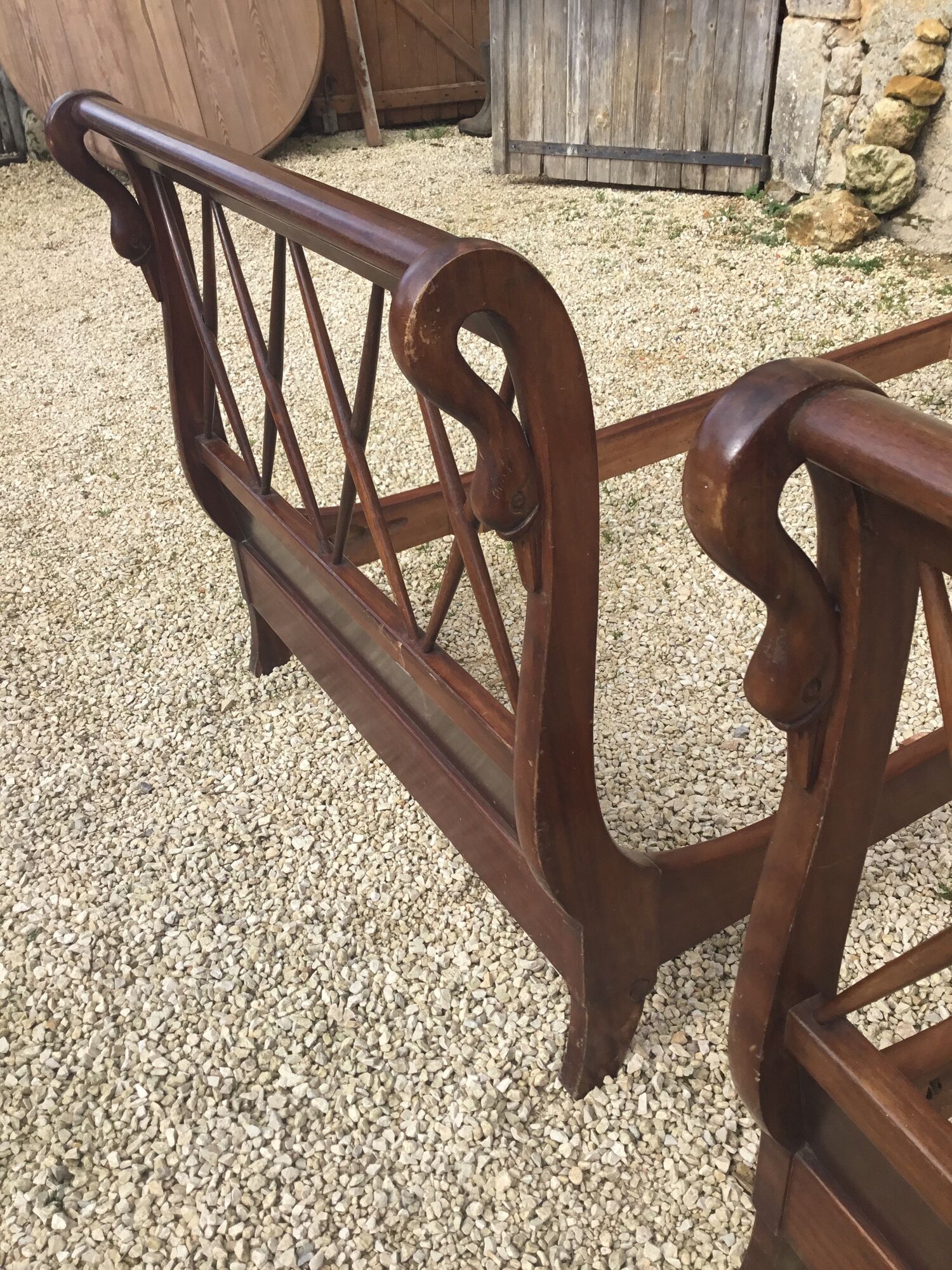 Pair of twin swan collar empire-style beds in mahogany XXth