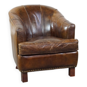 Stylish armchair made of cowhide leather with a unique design and beautiful finish