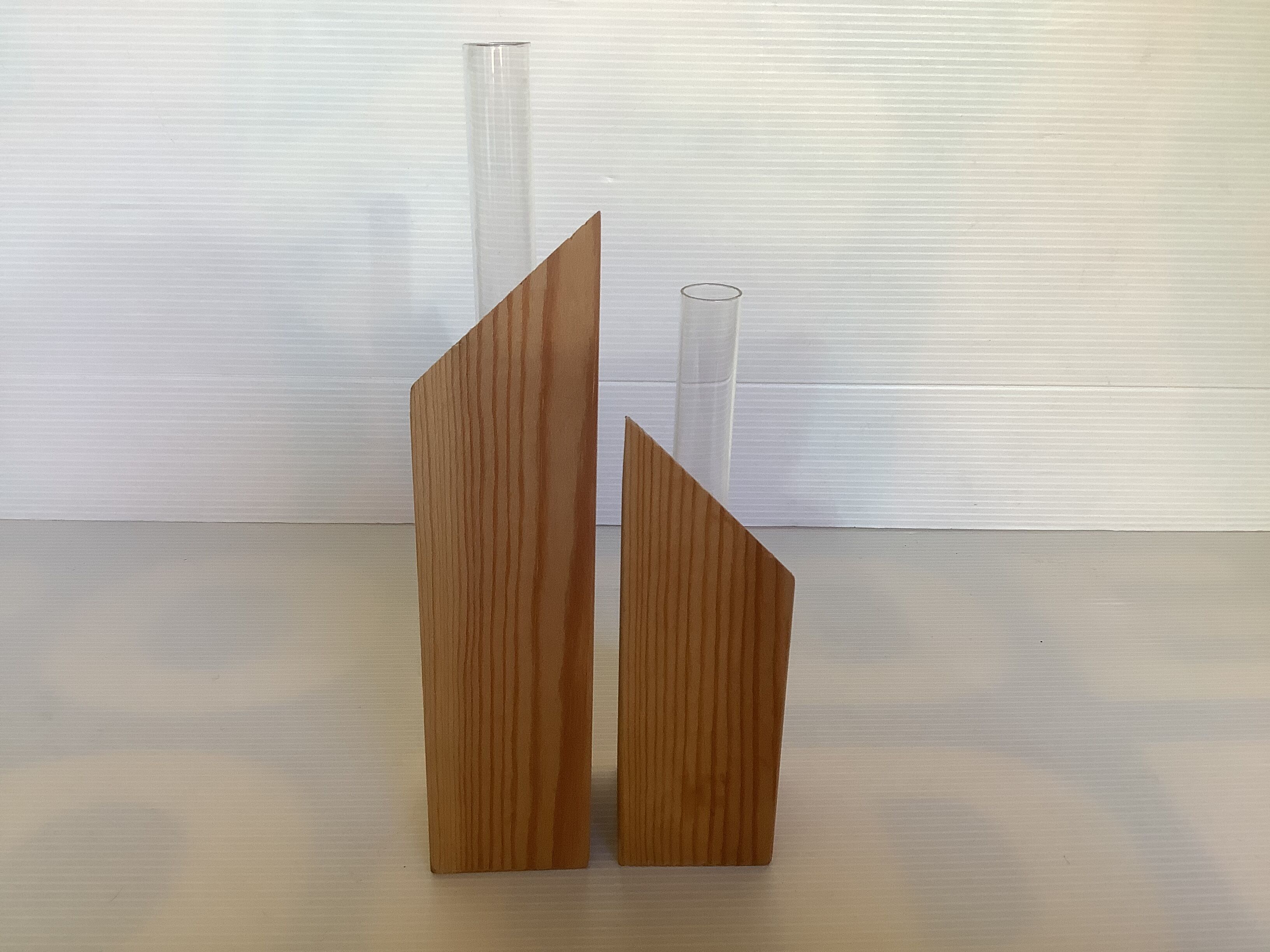 Pair of diamond-shaped wooden Scandinavian test tube vases.