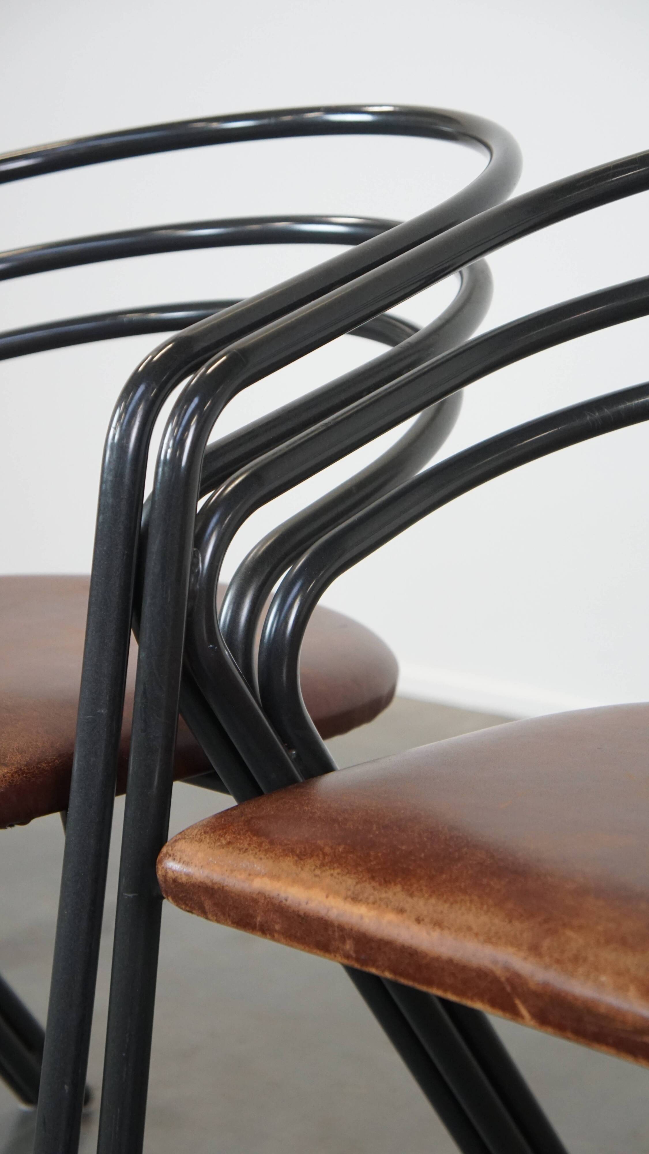 Set of 4 1970s design dining chairs with leather seats and metal frame