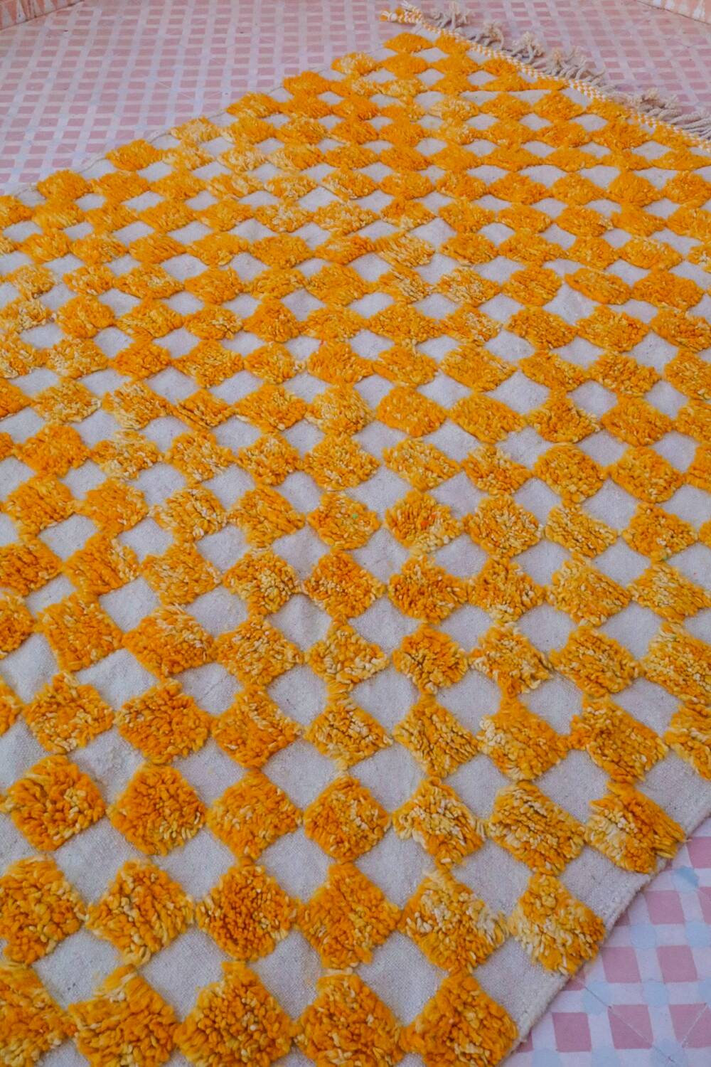 Yellow and white checkered Berber rug