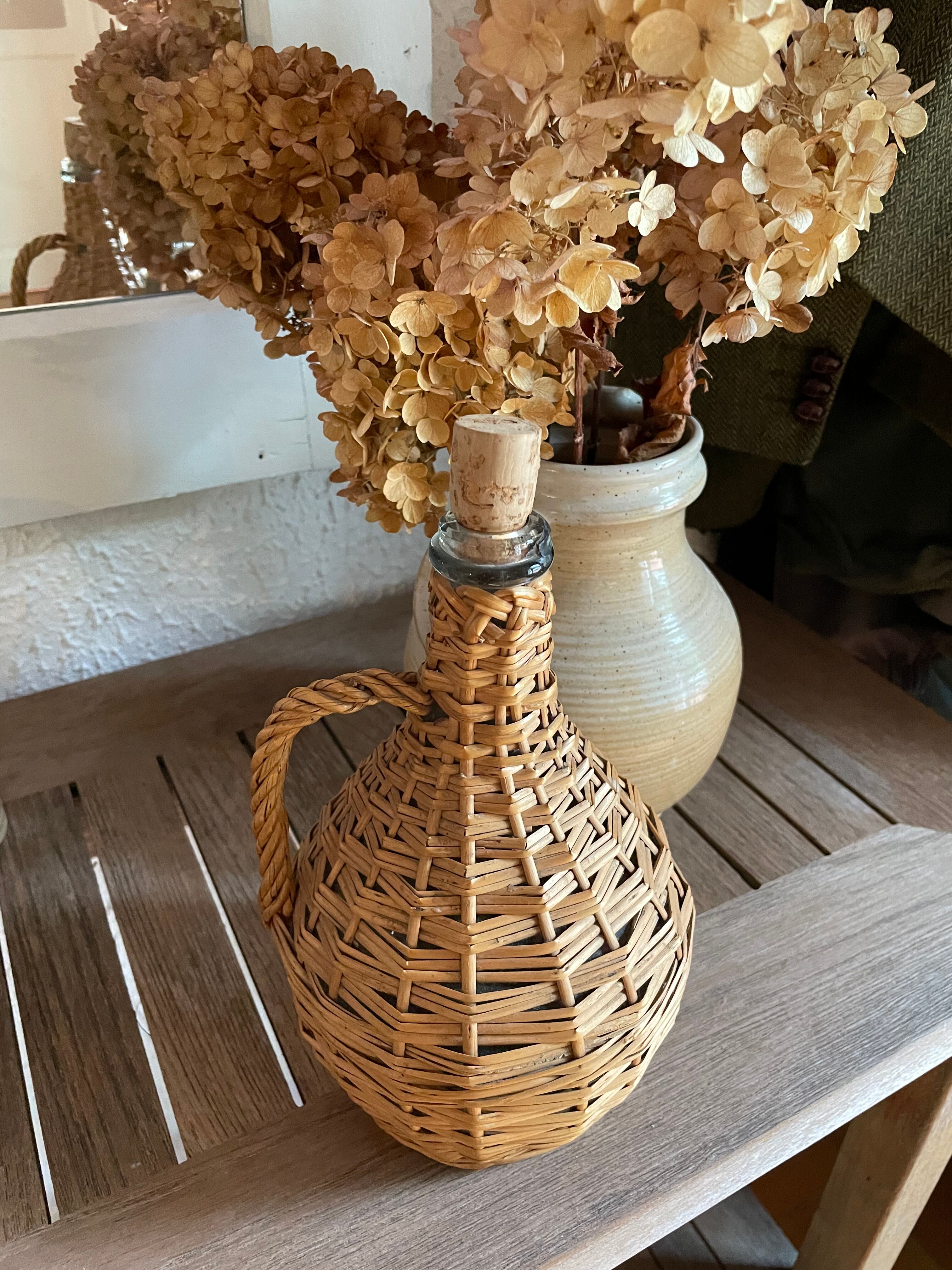 Glass bottle surrounded by wicker