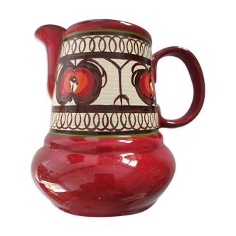 Red water pitcher and assorted plate