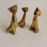 Trio of cats in gilded brass