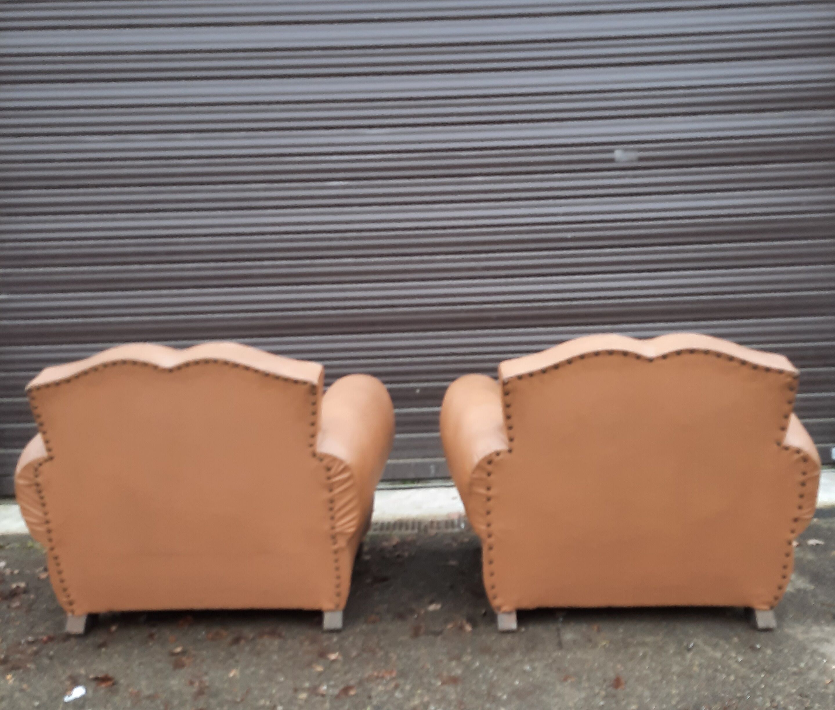 Pair of club chairs in skai