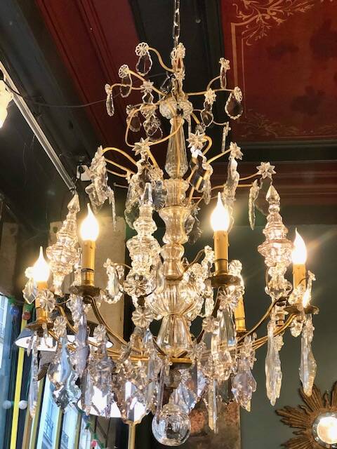 Large chandelier with tassels and old daggers