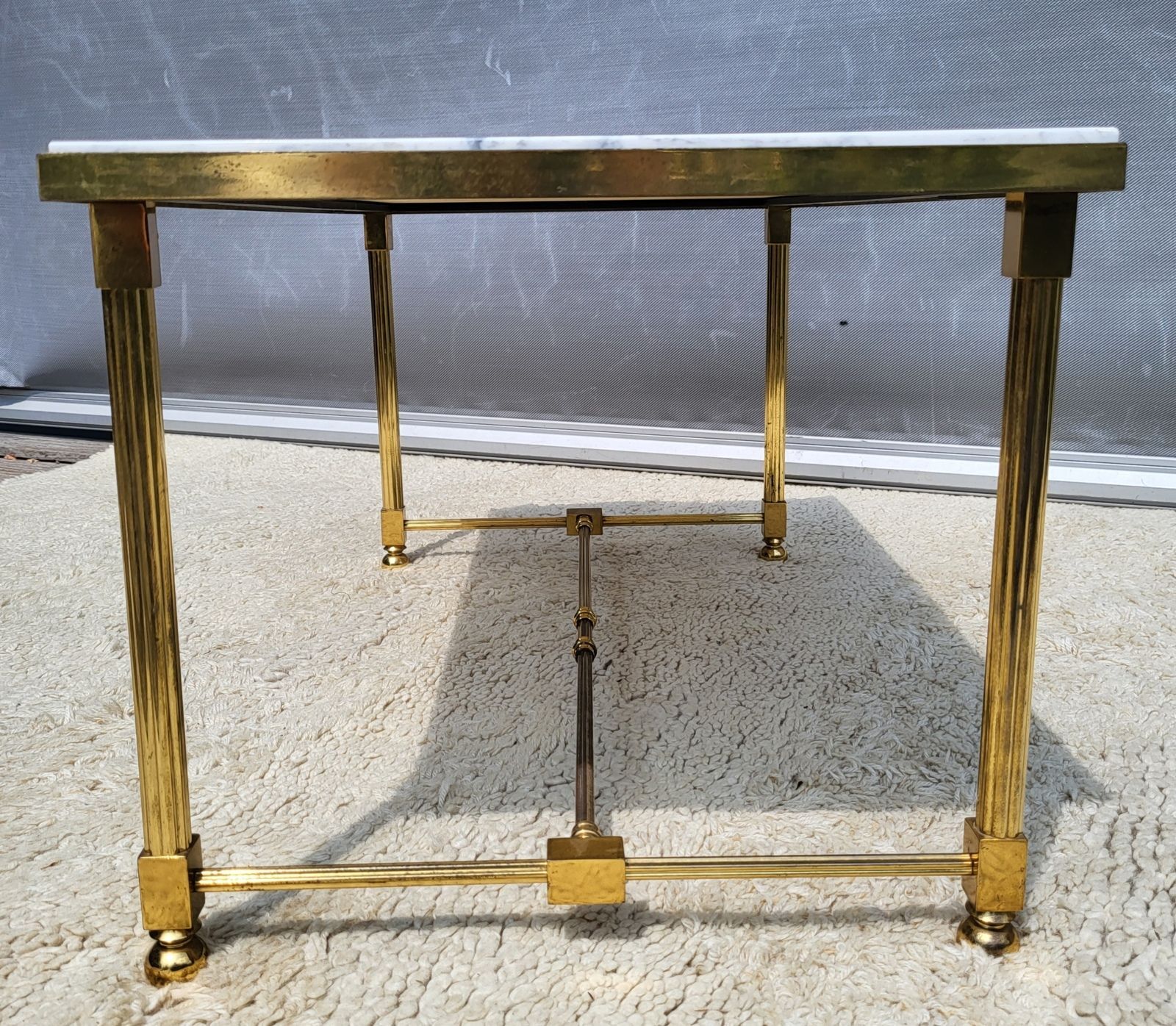 Hollywood Regency style coffee table • marble and brass