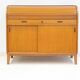Modern Scandinavian wardrobe in teak with sliding doors and drop-down flap.
