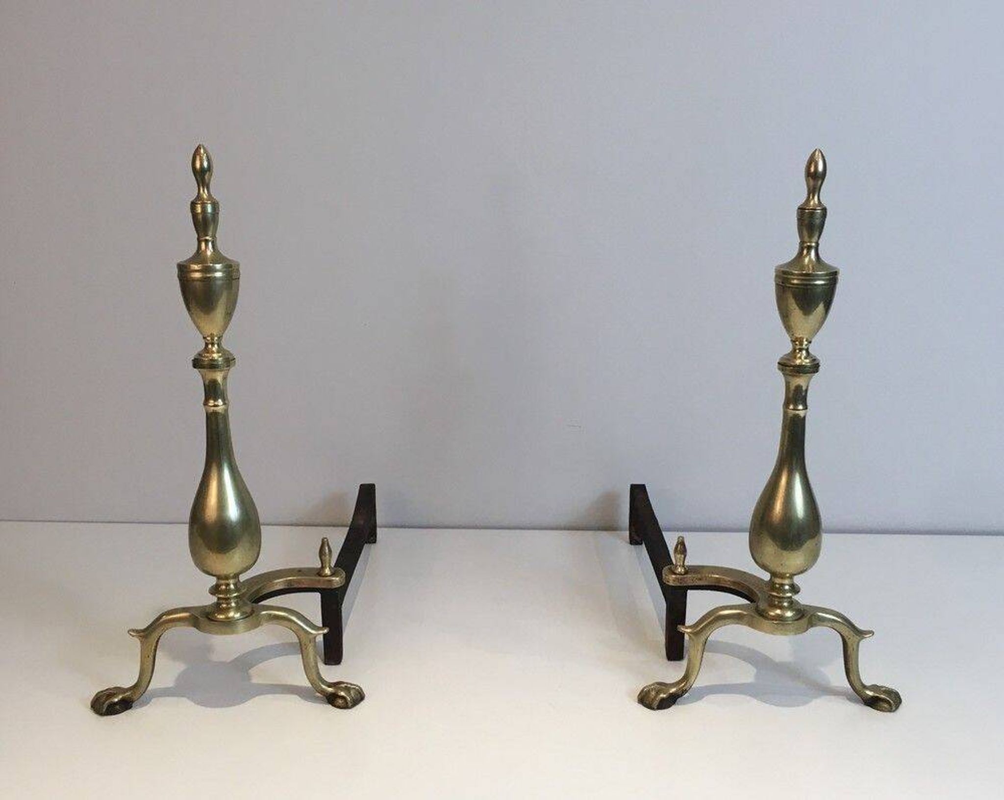 Pair of neo-Gothic bronze and wrought iron andirons
