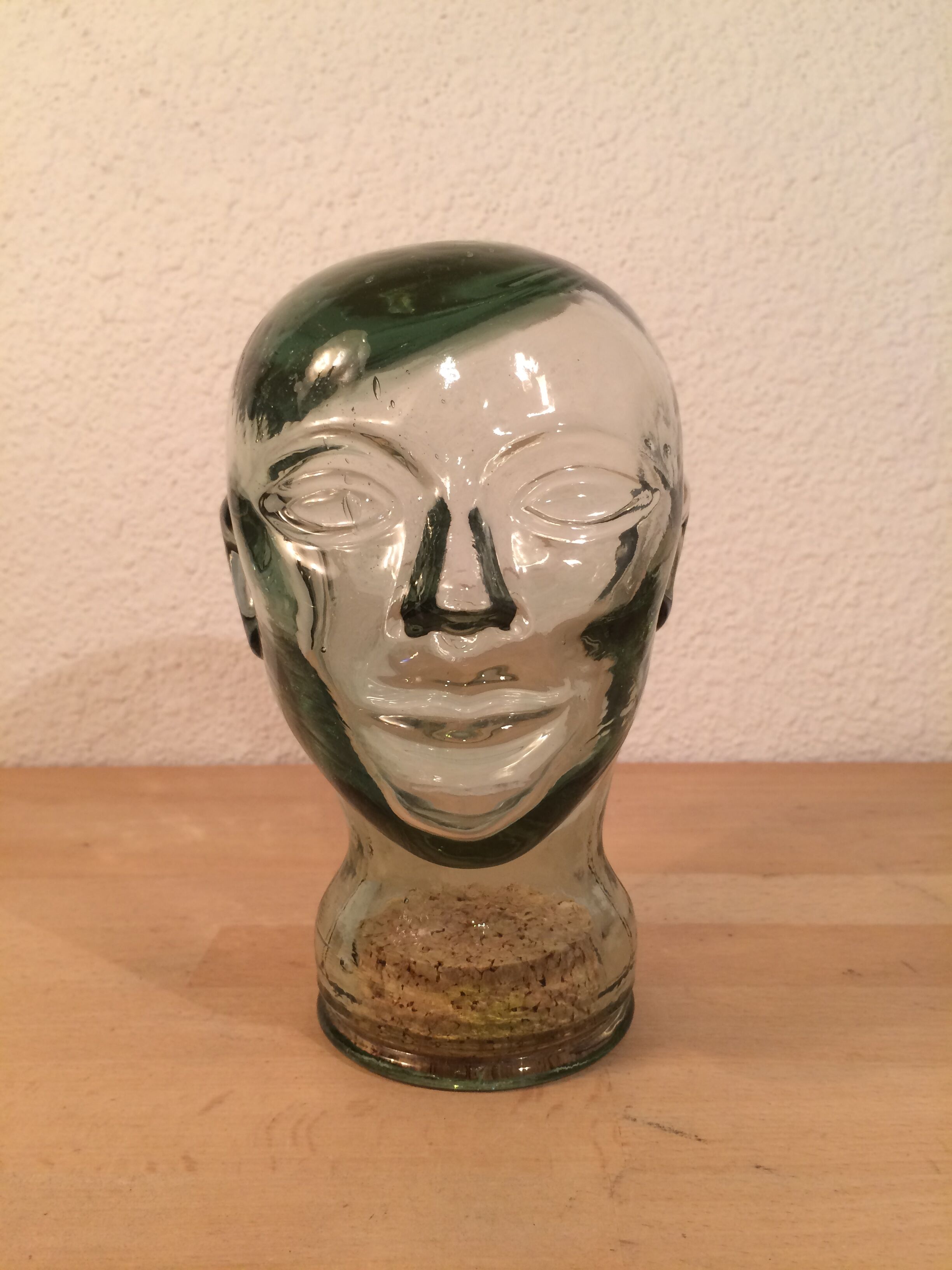 Molded glass head curiosity cabinet