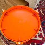 Round orange plastic side table 1970