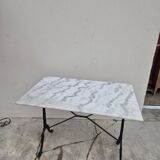 Antique marble and cast iron bistro restaurant table