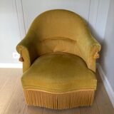 Velvet armchair with fringes