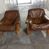 Armchairs in leather and vintage wood 70's