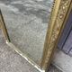 Large Louis Philippe mirror in carved gilded wood with mercury glass.