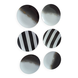 Set of 6 flat plates in Limoges porcelain, signed Marie Daagé.