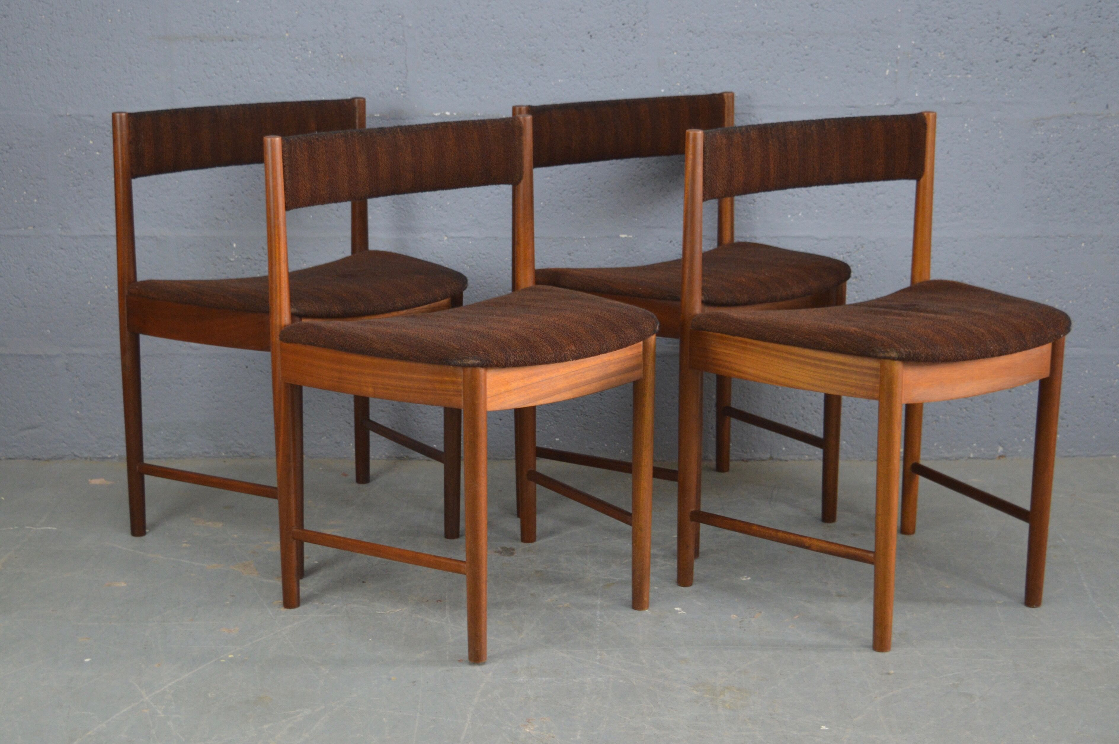 Round teak dinning table and chairs by Mctintosh