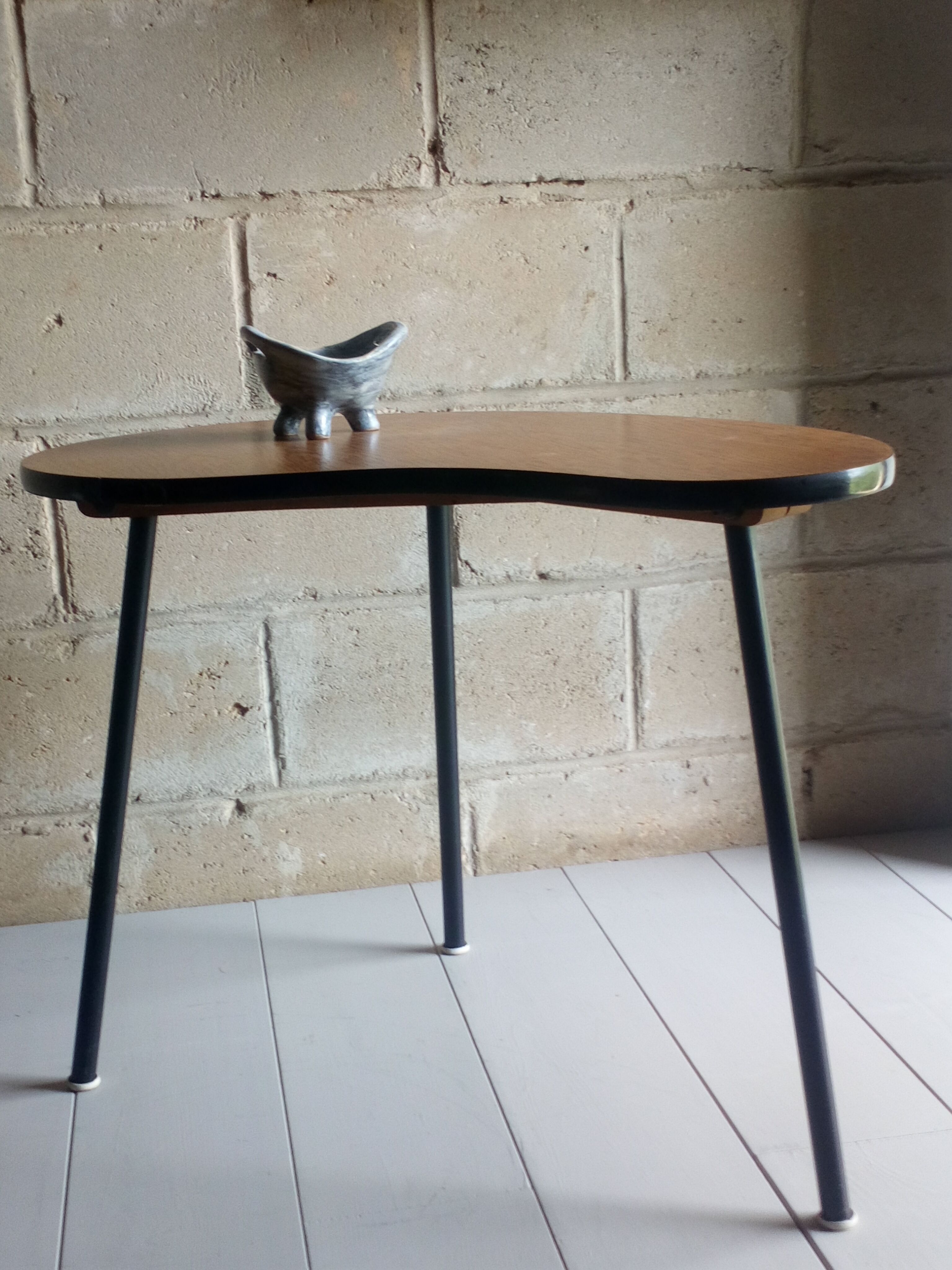 Scandinavian side table shaped bean with three feet