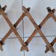 Old accordion wall coat rack