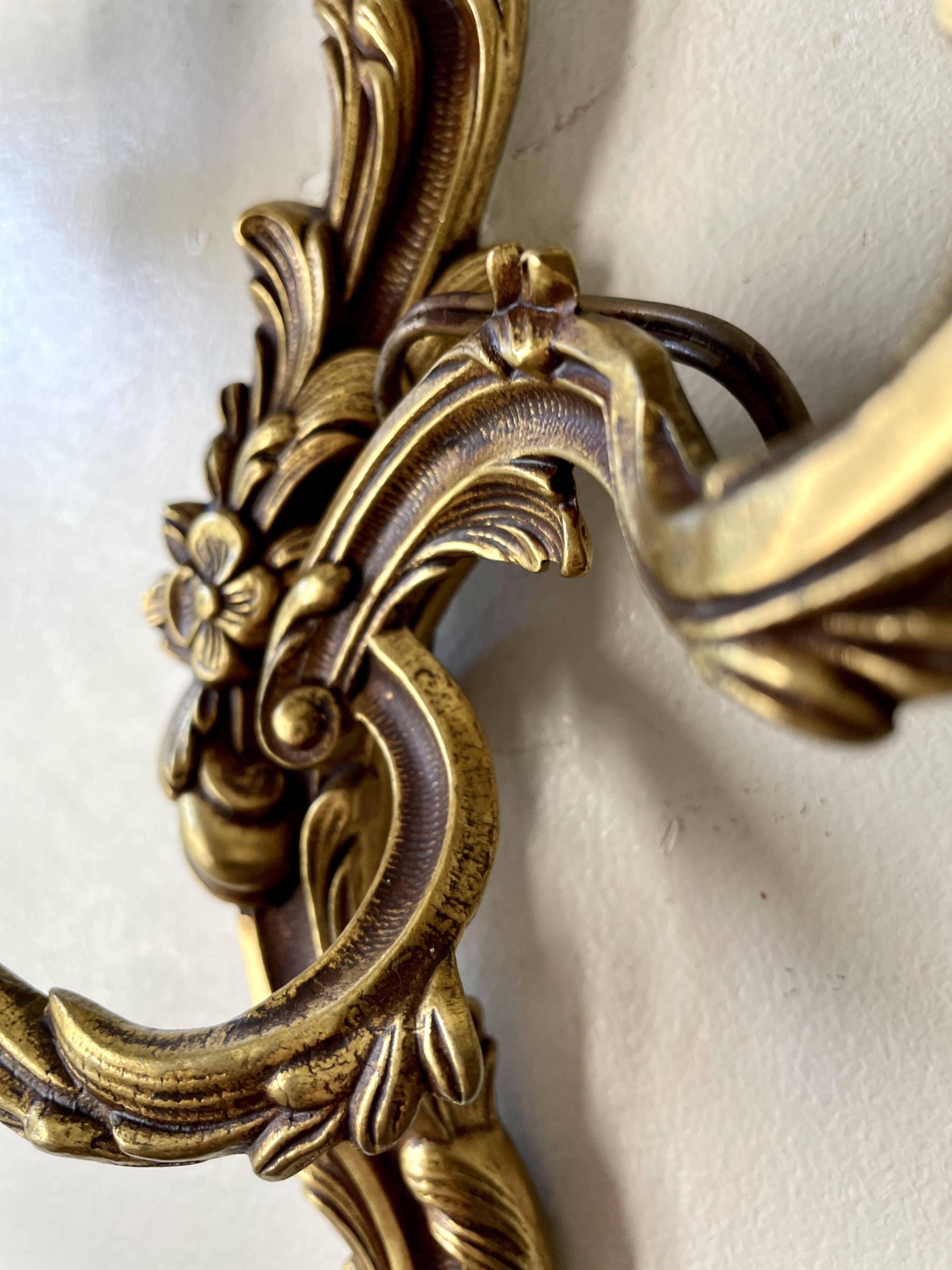 Pair of rocaille bronze wall sconces