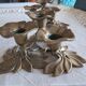 Pair of antique three-branch candlesticks with a floral design.