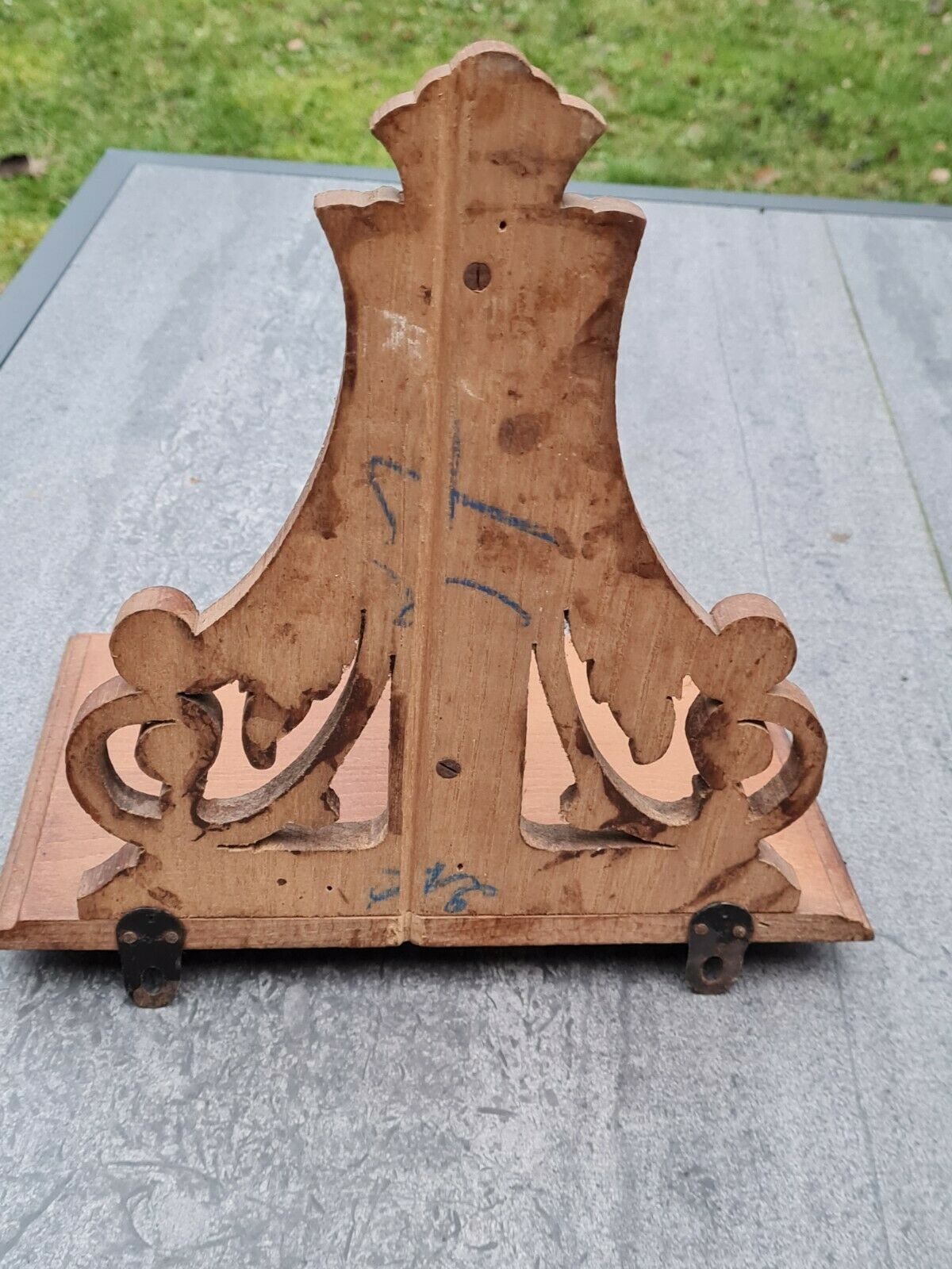 Openwork wooden wall shelf