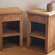 Pair of antique bedside tables / nightstands in raw solid oak.