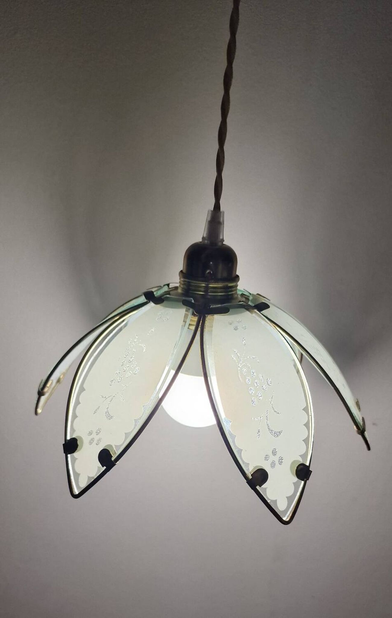 Glass flower rimmed with brass