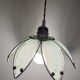 Glass flower rimmed with brass