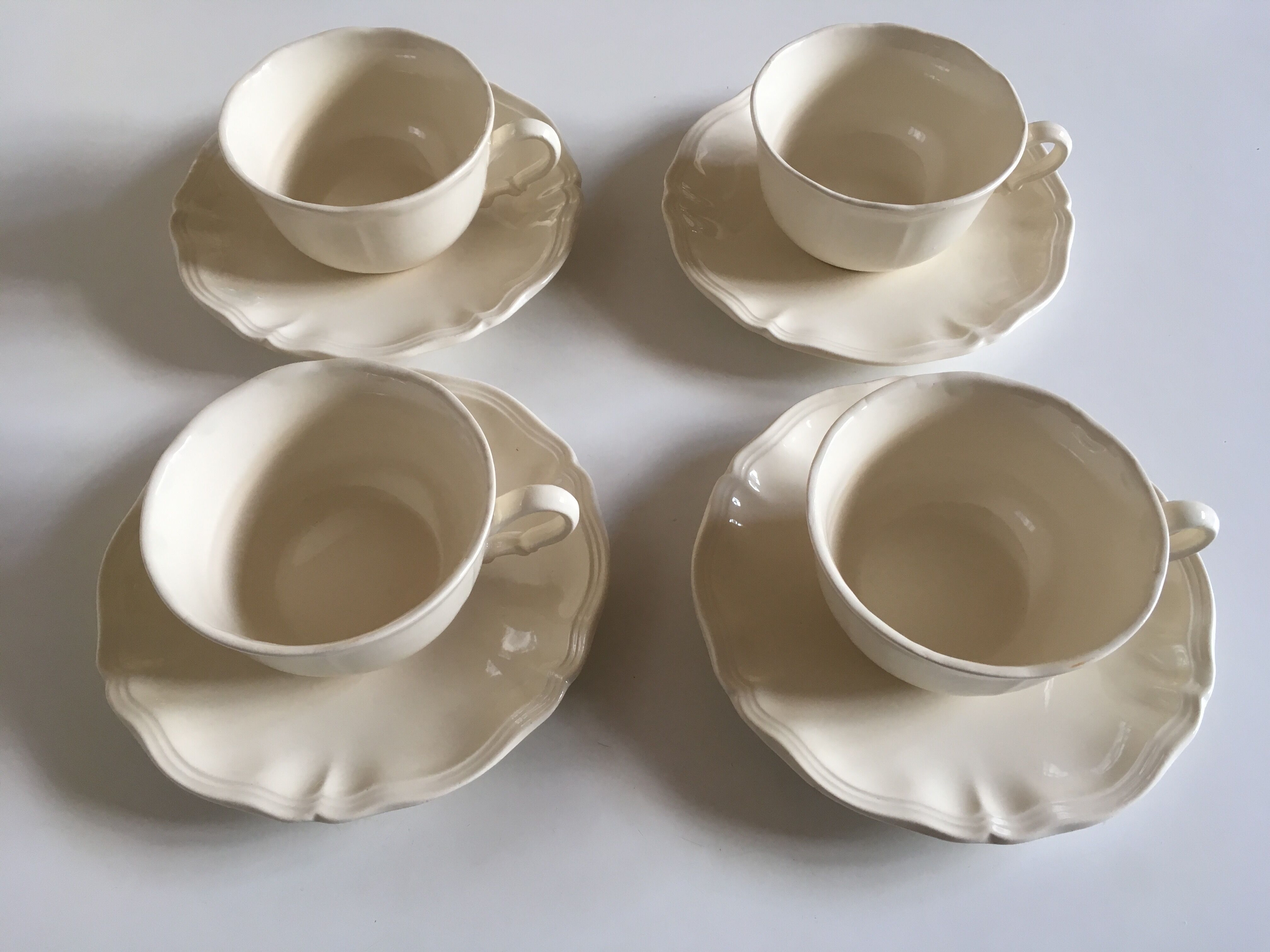 Set of 4 cups breakfasts in faience Sarreguemines ivory to godrons